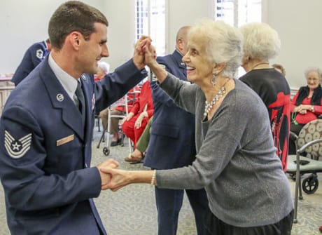 Residents enjoying a dance activity with staff members