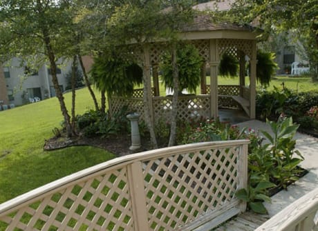 A gazebo in a landscaped garden area