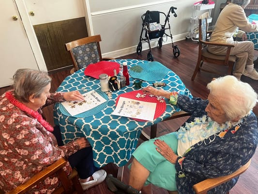 Residents engaged in an activity at a table