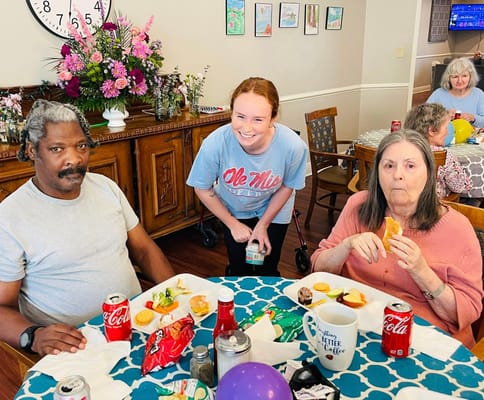 Residents enjoying a meal together in a common area