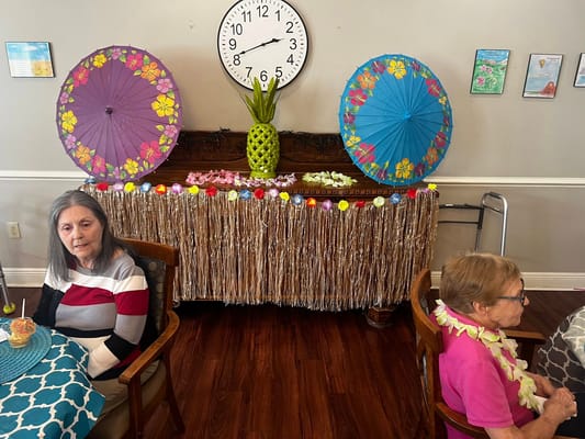 Residents celebrating with themed decor and refreshments