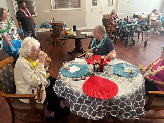 Residents enjoying a meal at a dining table