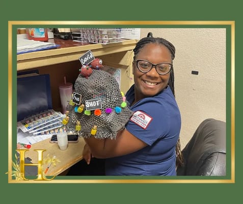 Staff member participating in an arts and crafts activity