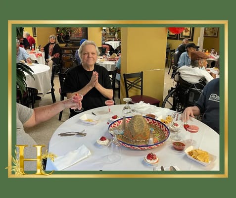 Residents enjoying a meal in the dining room.