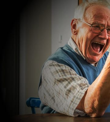 Smiling elderly man in a care facility