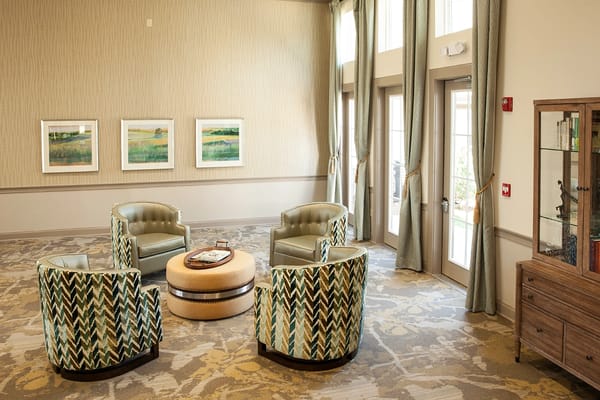 Bright common area with seating and natural light