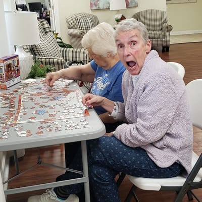 Residents enjoying a puzzle activity together