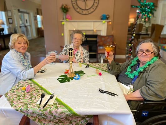 Residents enjoying a festive gathering in the common area