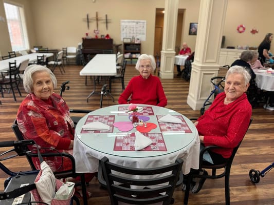 Residents enjoying a meal together in the dining room