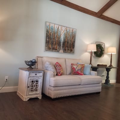 Cozy interior living space with a sofa and artwork