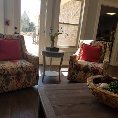 Brightly lit seating area with colorful chairs