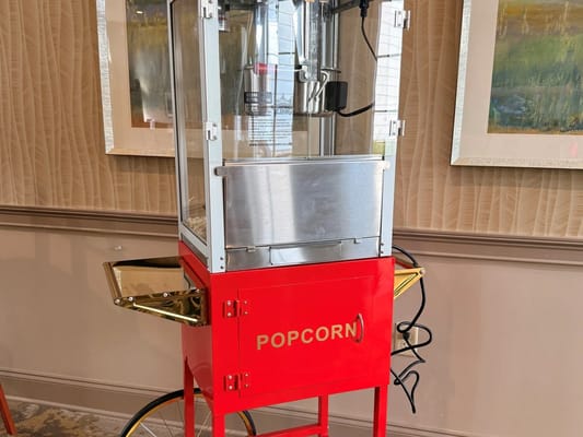 A vintage popcorn machine in a facility common area