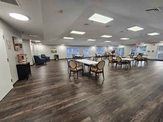 Bright common area with tables and chairs