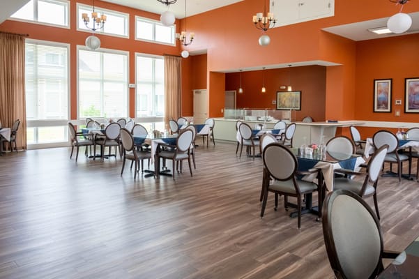 Bright dining area with tables and chairs