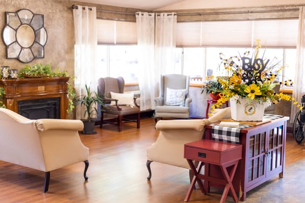 Cozy common area with seating and floral décor