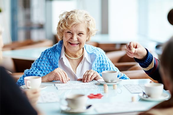 Residents enjoying a bingo game in a common area