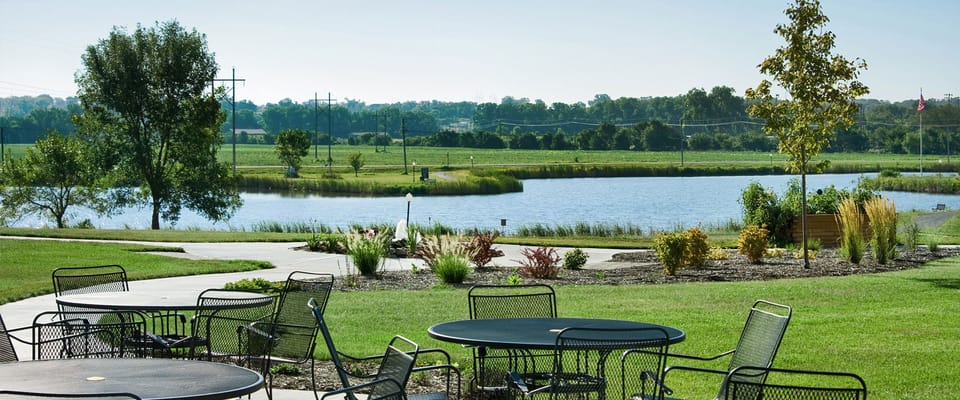 Beautiful outdoor seating area by the pond
