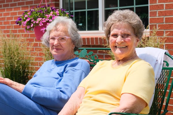 Two elderly women enjoying time outdoors