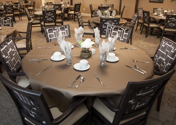 Elegant dining room setup with tables and chairs