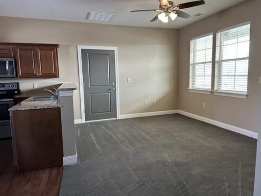 Interior view of a spacious living area in a retirement unit