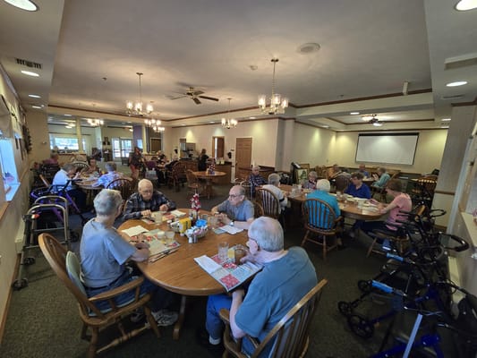 Residents enjoying meals in a cozy dining room