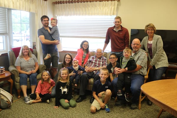 Residents and family gathering in a common area