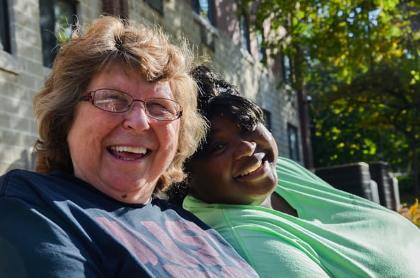 Two smiling women enjoying time outdoors