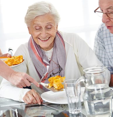 Residents enjoying a meal in the dining area