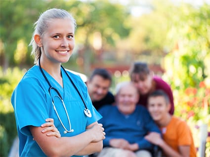 Medical staff with residents in a garden setting