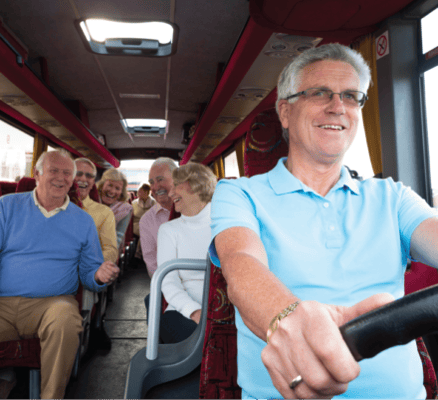 Residents enjoying a bus ride with a friendly driver