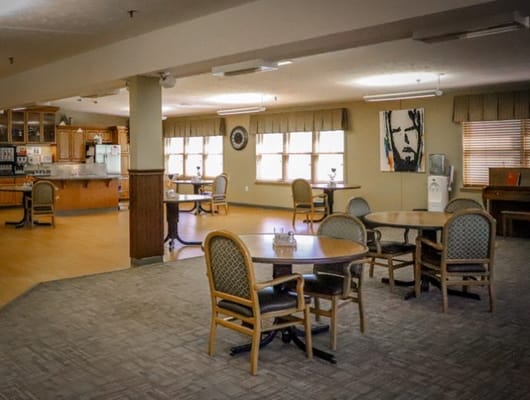 Interior view of a common area with tables and chairs