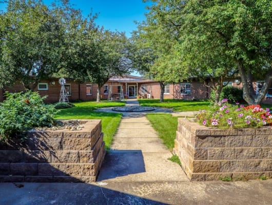 Pathway leading through a landscaped garden area