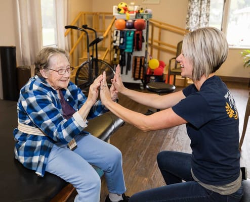 Therapist and resident engaging in a playful activity