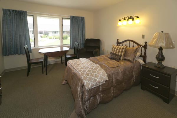 Cozy private room with a bed and sitting area