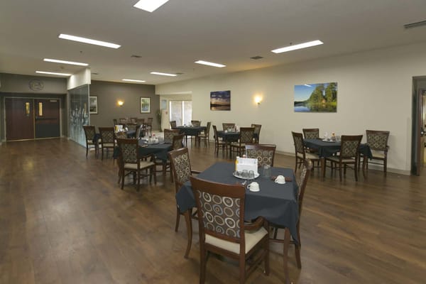 Dining area with tables set for residents