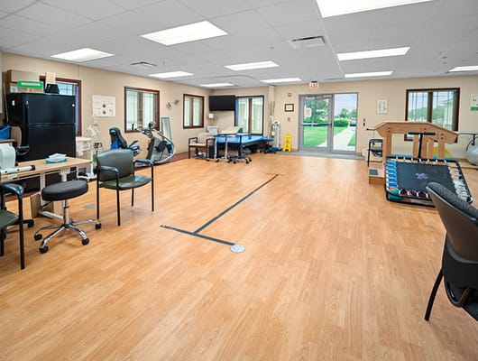 Therapy room with exercise equipment and natural light