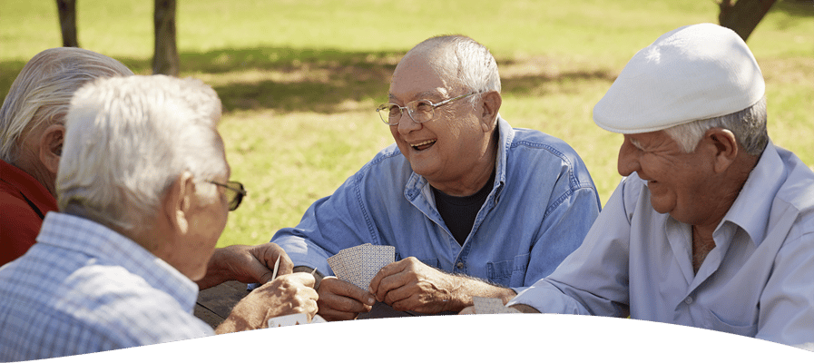 Residents enjoying a game of cards outdoors