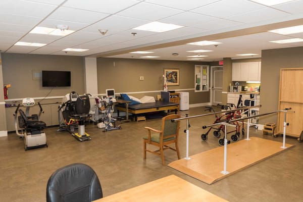 Therapy room with exercise equipment and rehabilitation setup