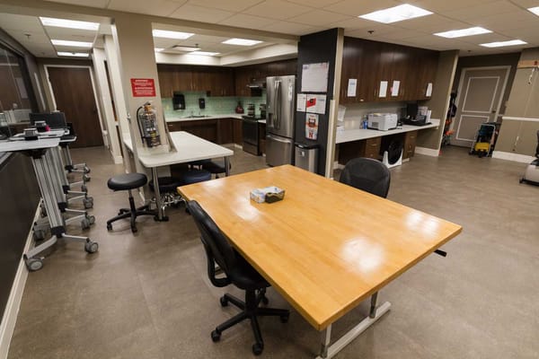 Interior view of a kitchen area with a large table