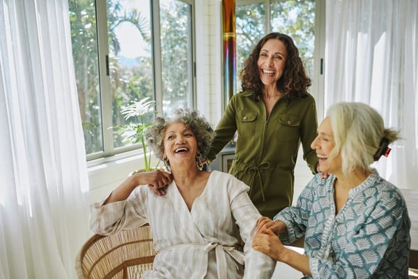 Residents enjoying a moment together in a bright common area