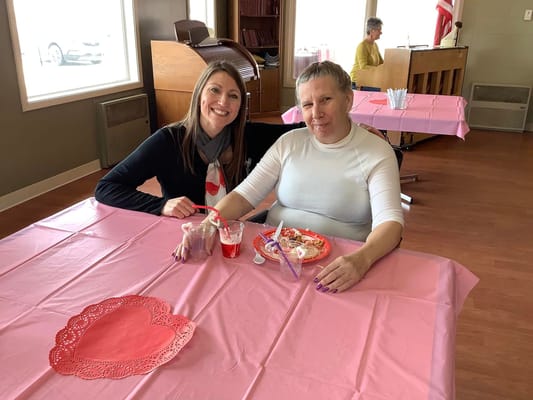 Residents enjoying a meal together at a table
