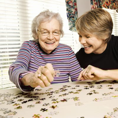 Residents enjoying a puzzle activity together
