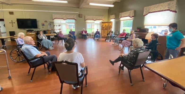 Residents engaged in an activity in a common room