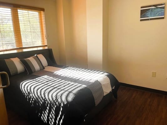 Brightly lit private bedroom with natural light