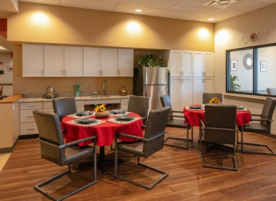 Bright dining room with tables set for a meal