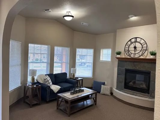 Cozy living room area with a fireplace and seating