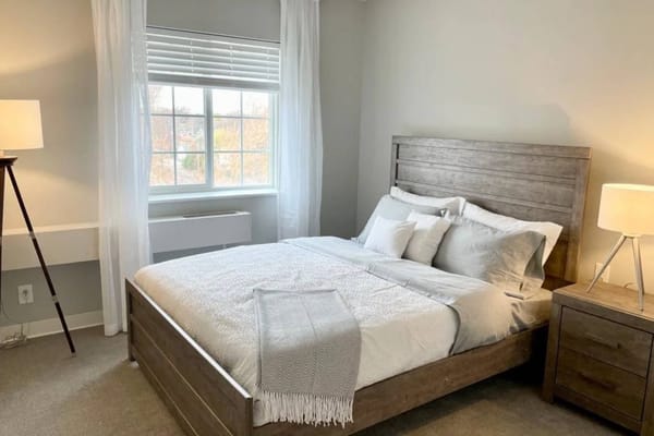 A beautifully arranged private bedroom with natural light