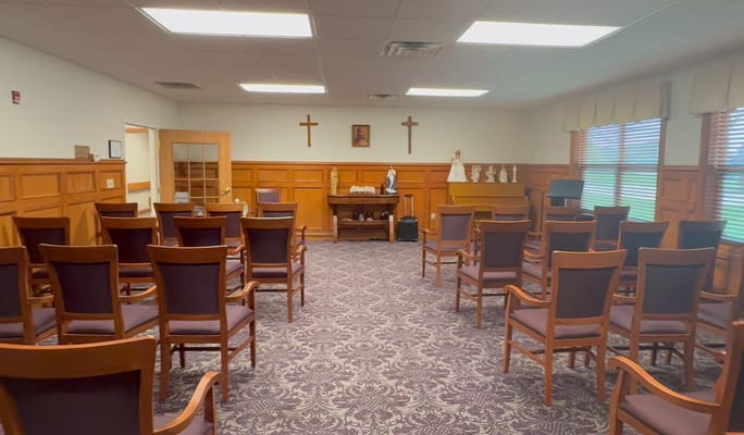 Interior view of a chapel-like room with chairs
