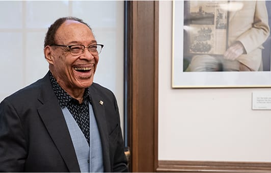 Smiling resident in a facility interior