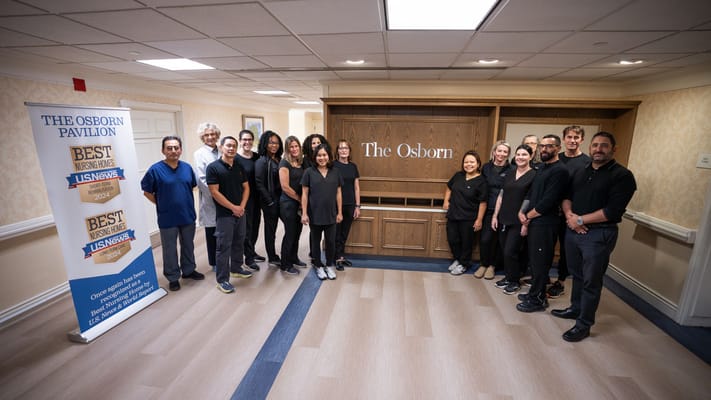 Staff members posing in the facility's lobby area